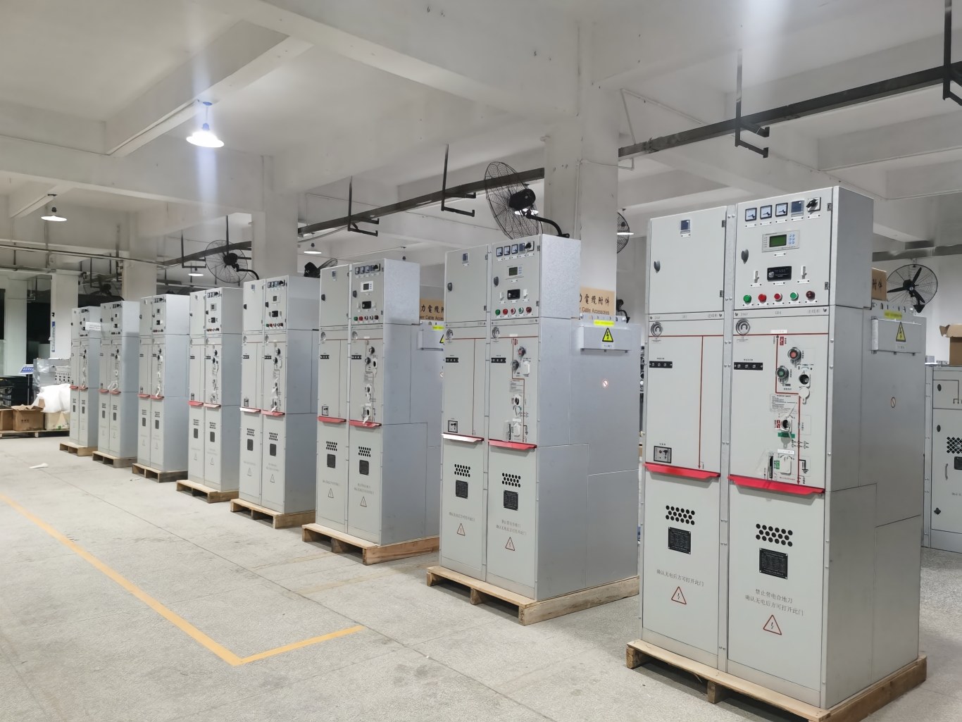 Batch of finished medium voltage switchgears lined up in manufacturing plant