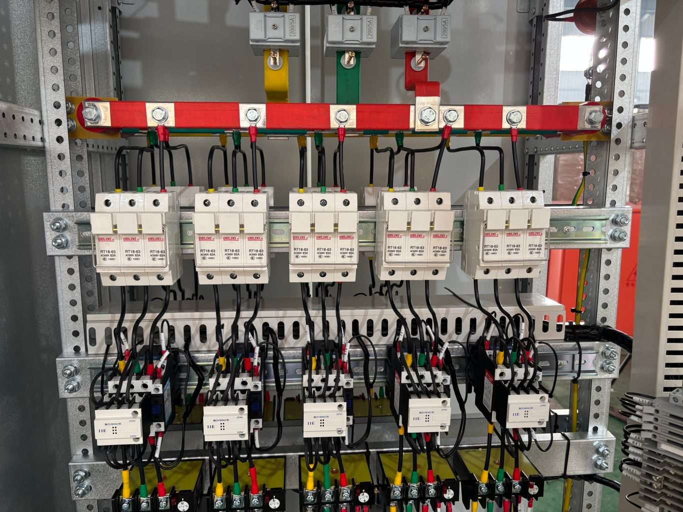 Fuse holders and contactors densely wired on low voltage switchgear control panel