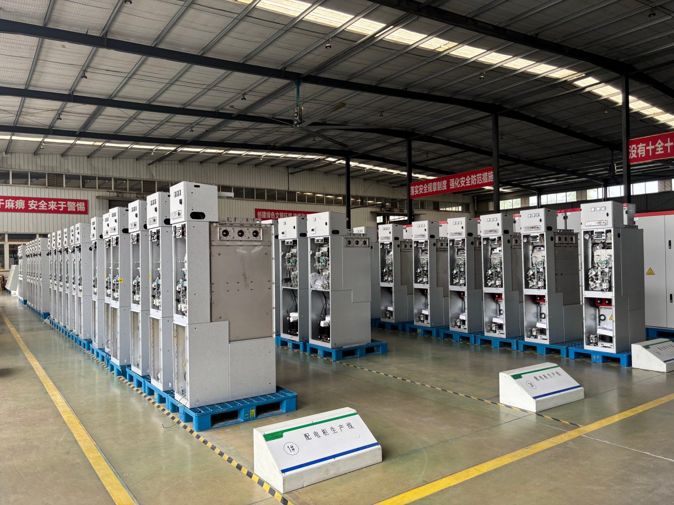 Gas‑insulated switchgear cabinets at workshop production line
