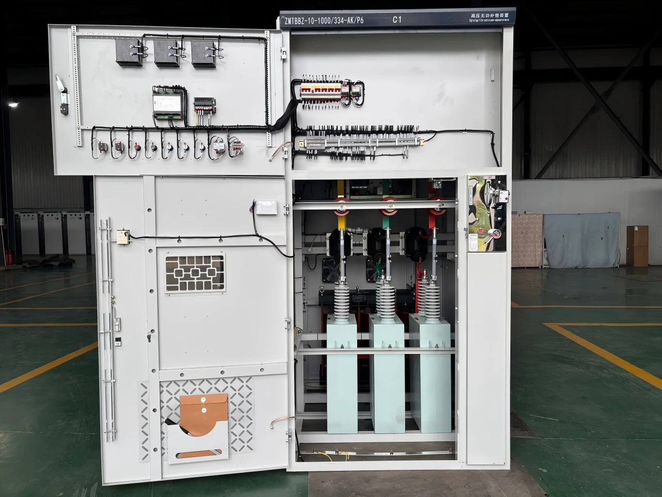Interior view of a metal enclosed capacitor bank cabinet with control relays and terminal blocks