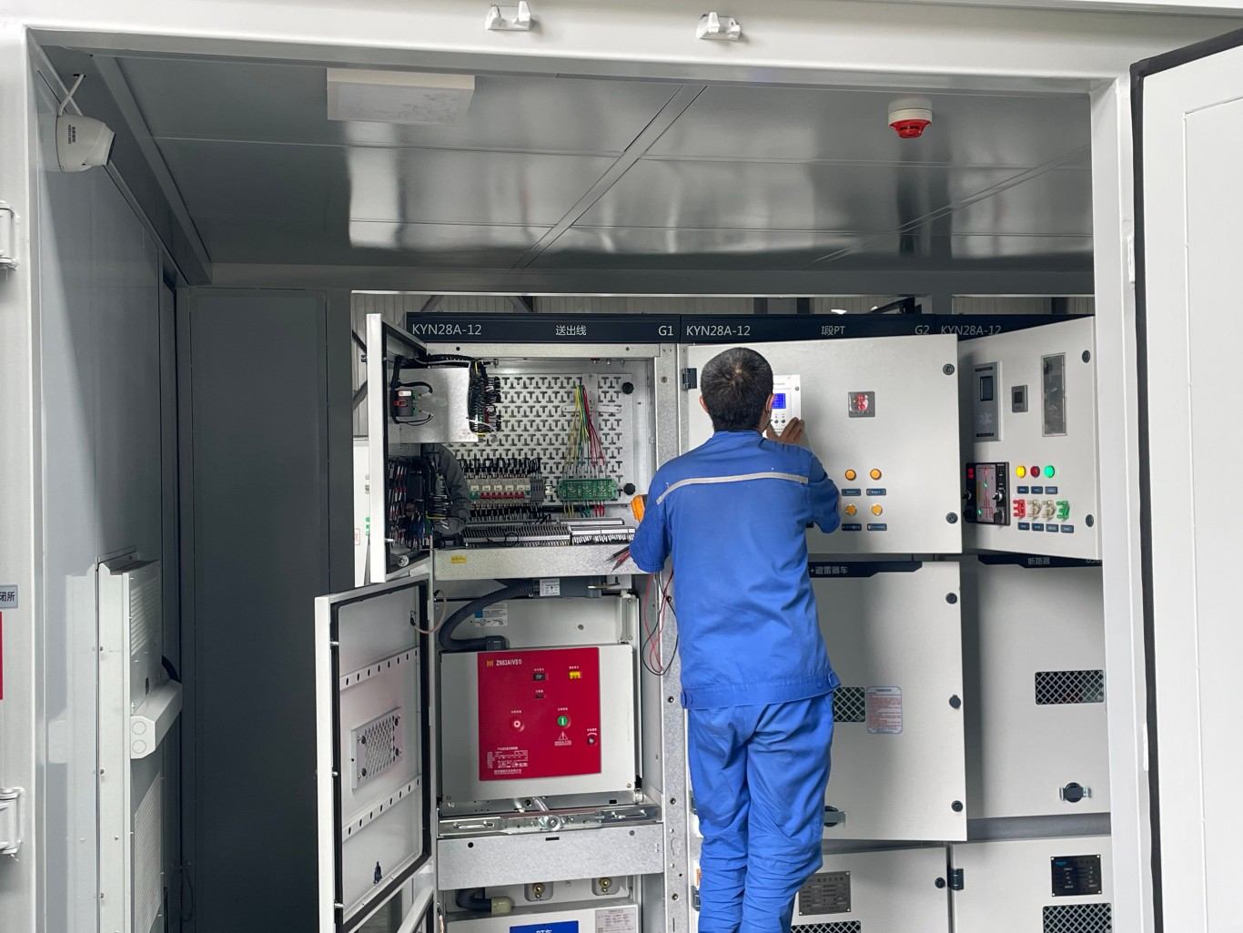 Technician commissioning medium voltage switchgear with vacuum circuit breakers