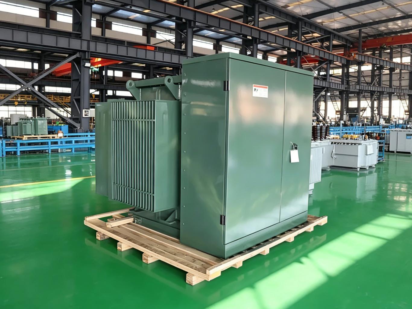 Green pad-mounted transformer in factory