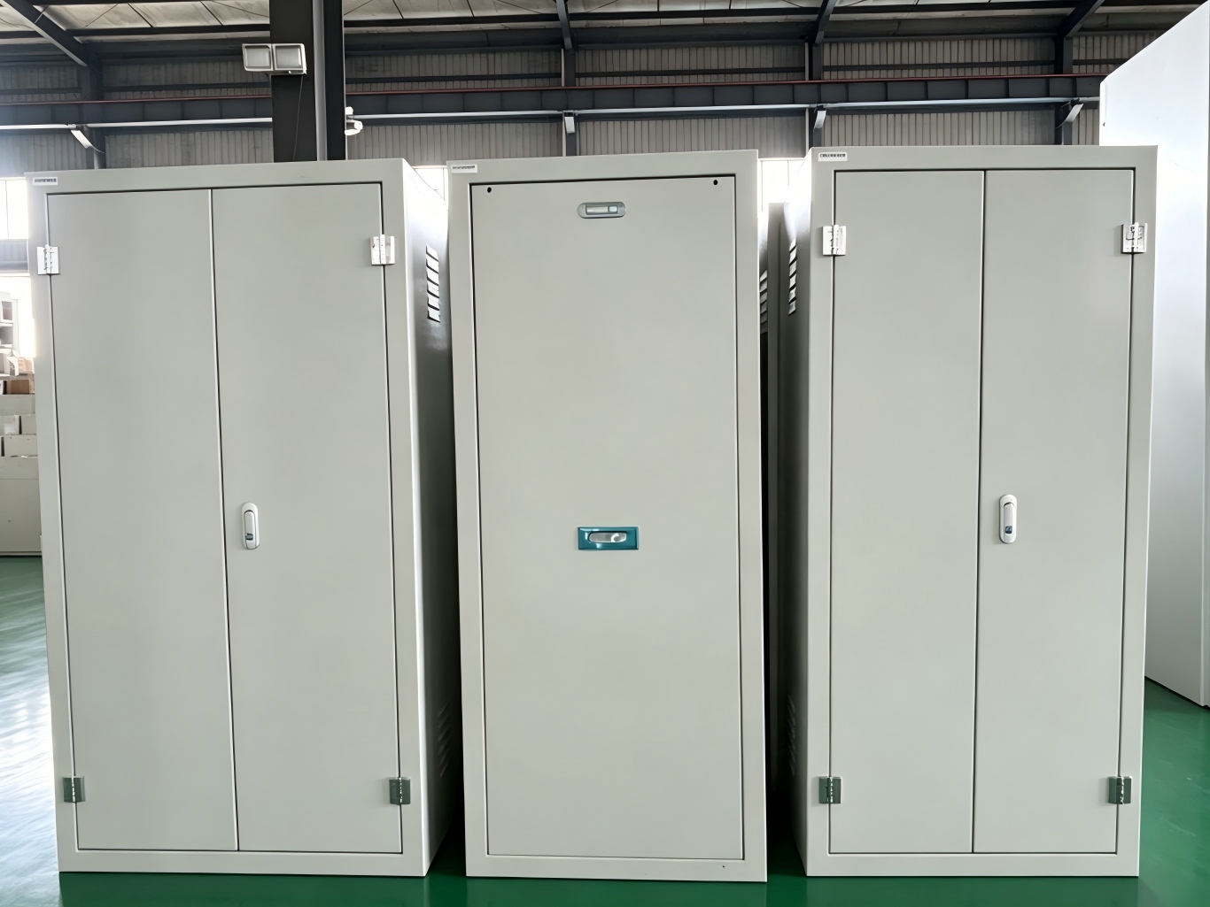 three indoor white power distribution cabinets