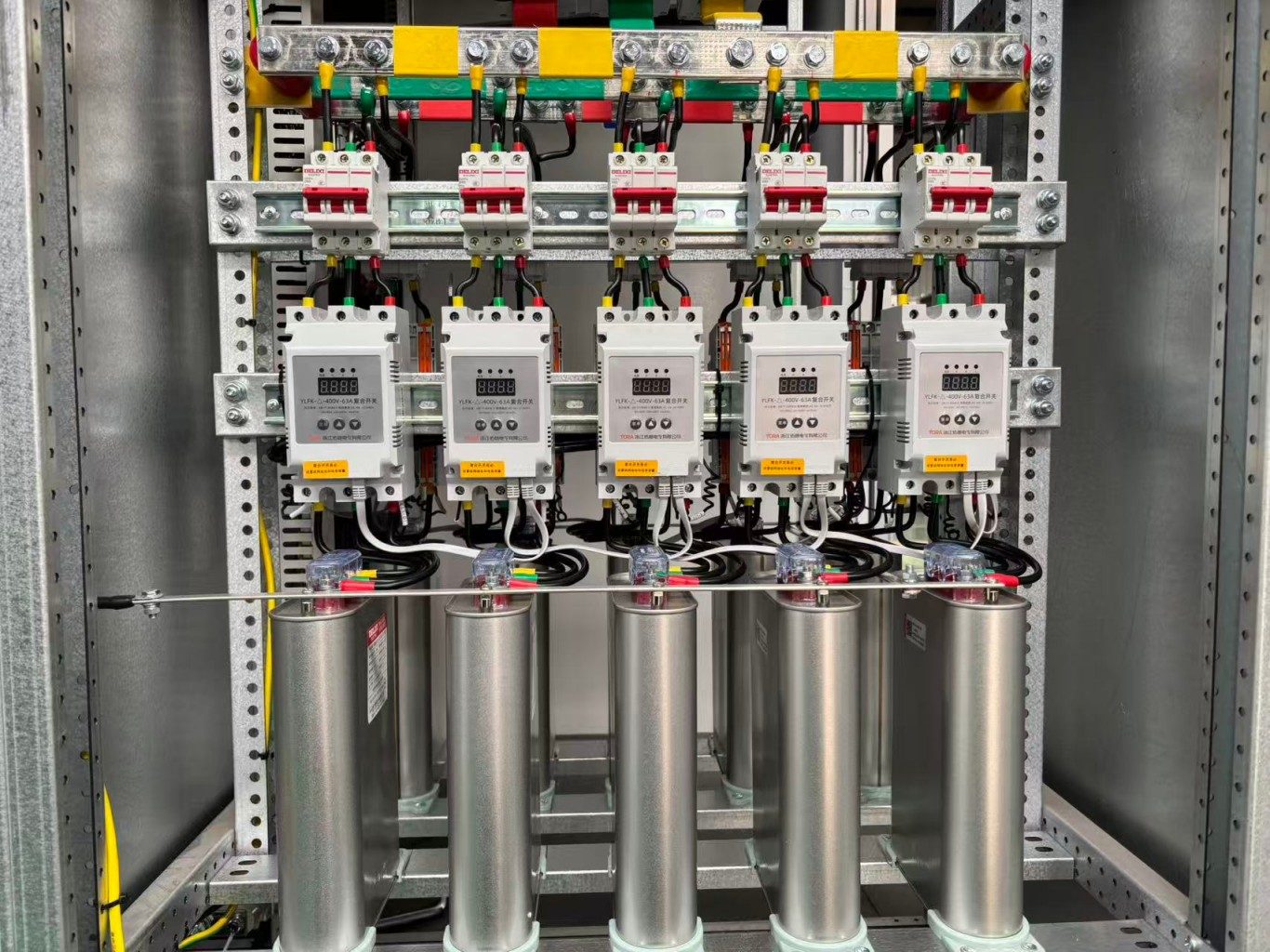 Low‑voltage capacitor bank inside compensation panel